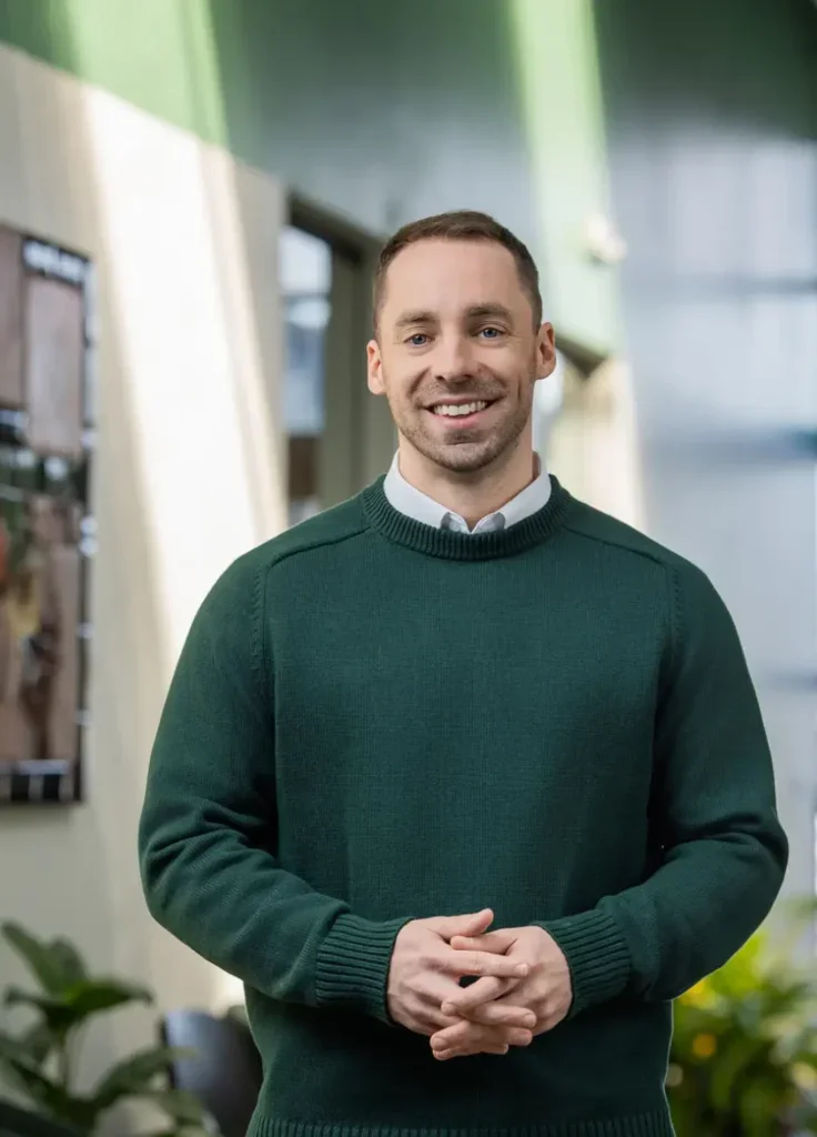 a man standing for his professional headshot
