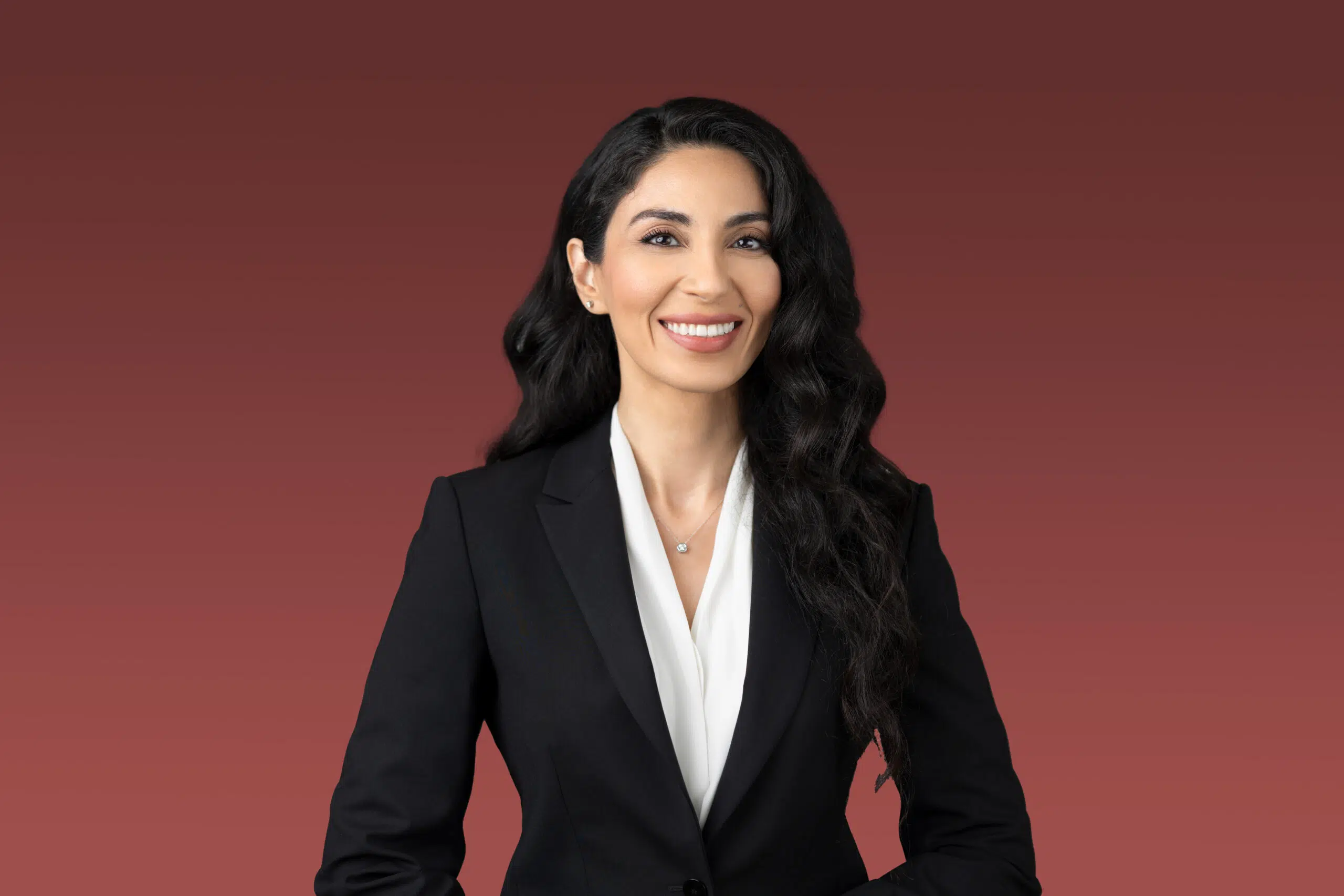 Professional headshot of a woman in a suit