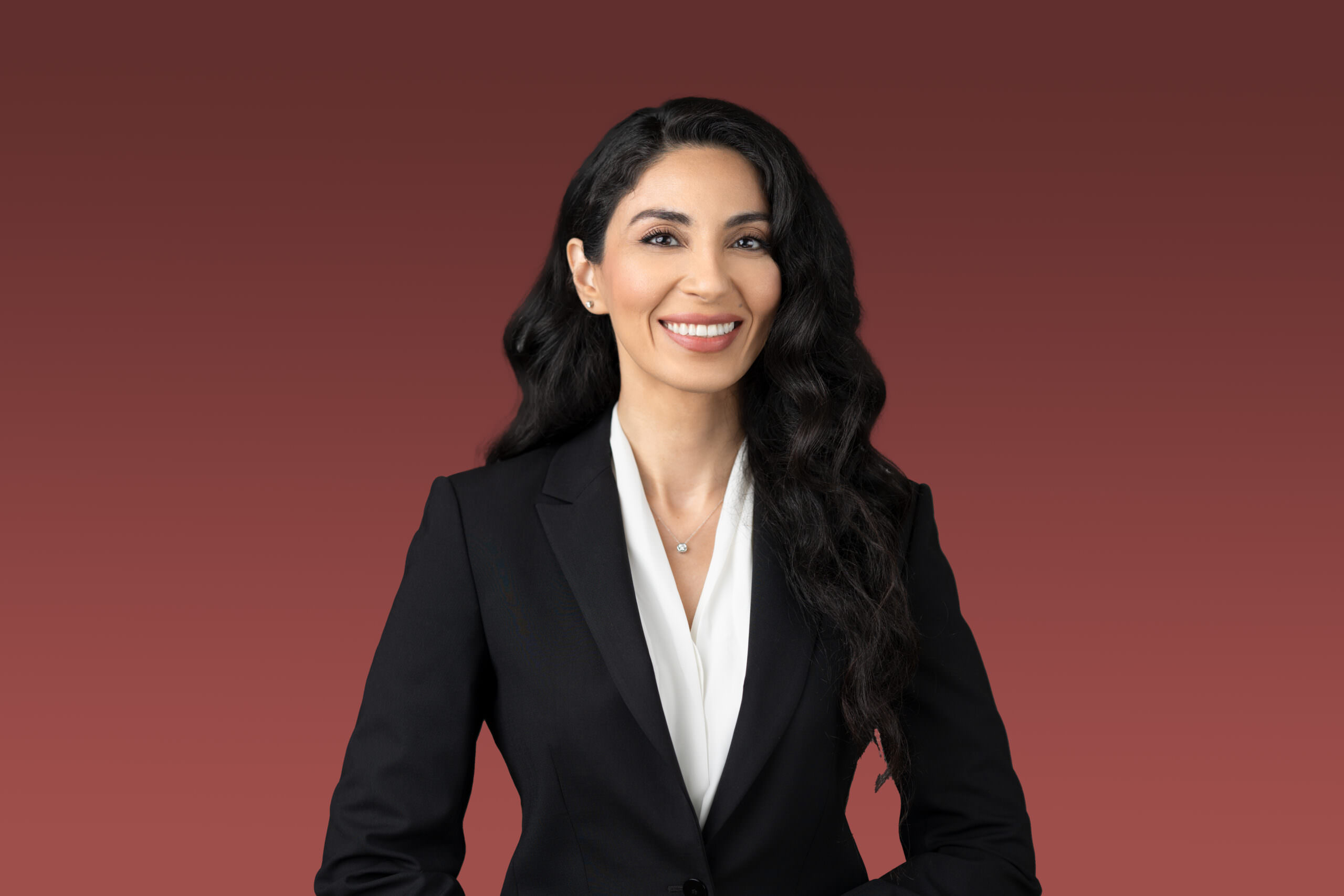 Professional headshot of a woman in a suit