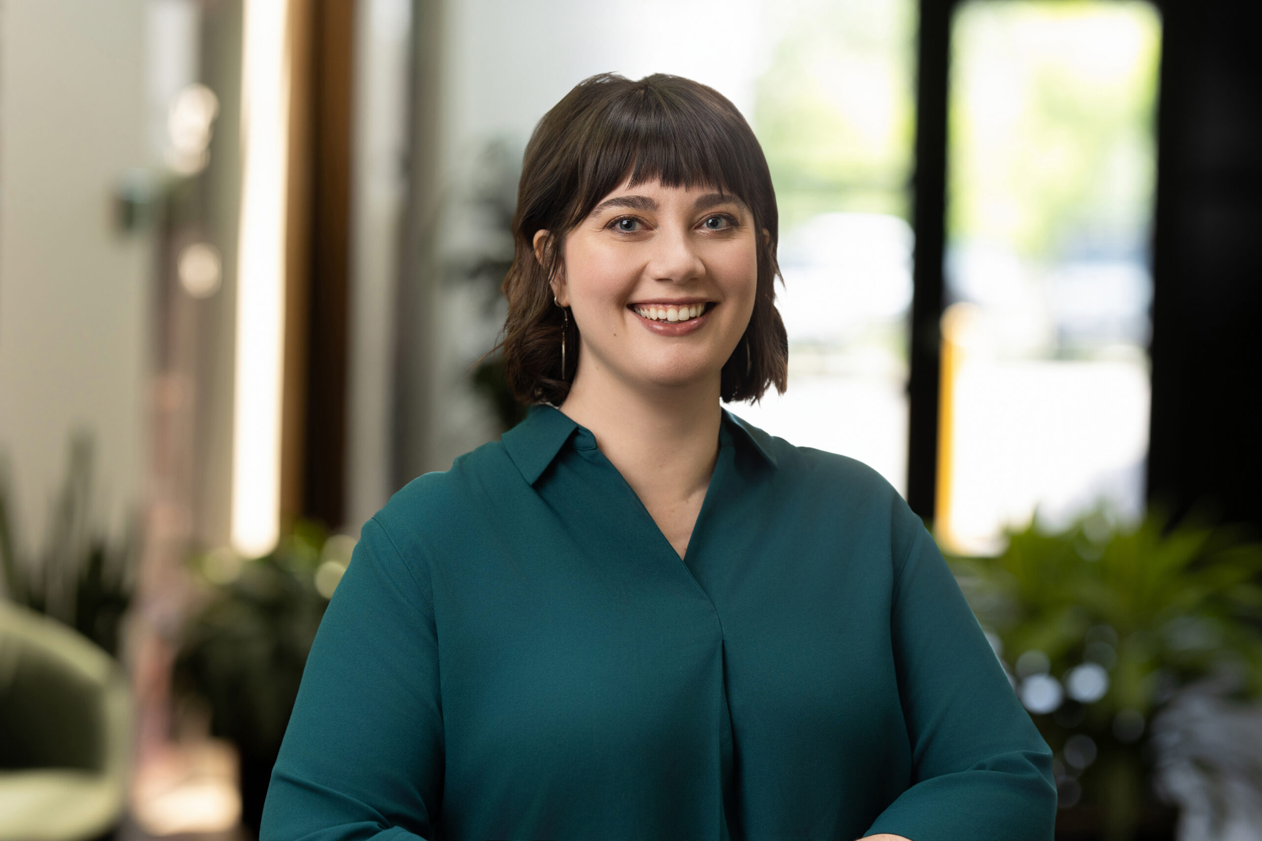 Professional corporate headshot of a smiling businesswoman for LinkedIn headshots in Lone Tree CO